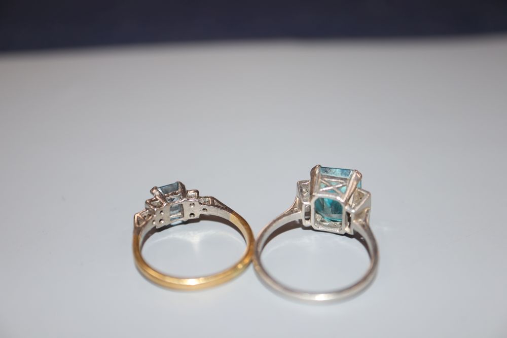 A white metal (stamped plat), blue zircon and diamond set dress ring, size L/M & an aquamarine & diamond ring.